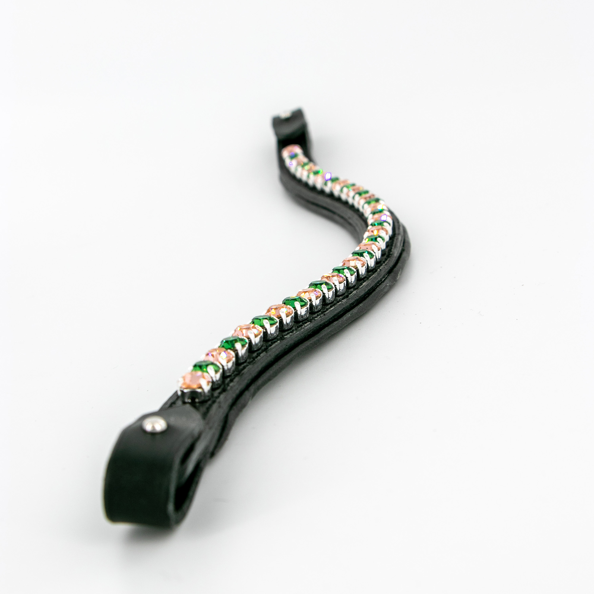 Detail of a black handmade browband with crystals in Vintage Rose & Erinite