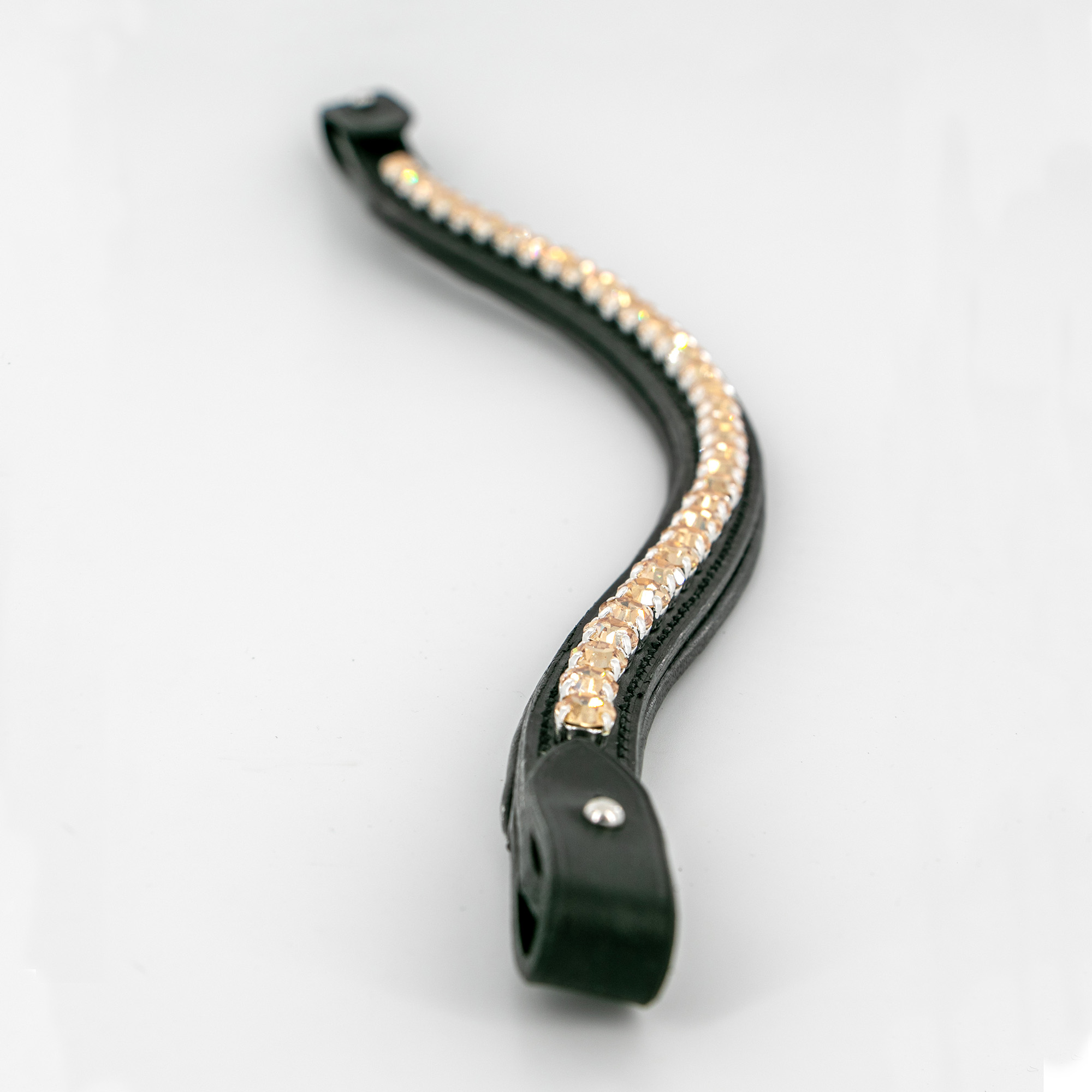 Detail of a black padded custom browband made with Preciosa Crystals in Golden Honey